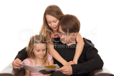 Father read a book with his ??daughters