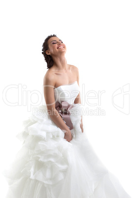 Smiling brunette posing in wedding dress