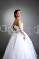 Cheerful model posing in wedding dress, close-up