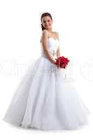 Pretty woman posing in wedding dress with bouquet