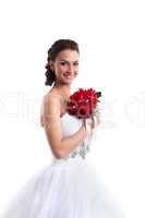 Portrait of smiling bride posing with bouquet