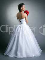 Image of young slim model posing in wedding dress