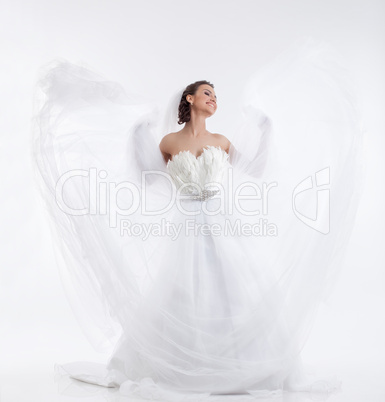 Cheerful beautiful bride isolated on white