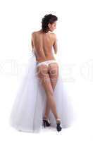 Slim naked bride posing back to camera
