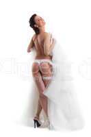 Image of young beautiful bride posing in lingerie