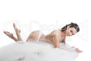 Portrait of young bride lying topless in studio