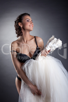 Portrait of cheerful bride posing naked in studio