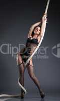 Image of hot slender woman posing with rope