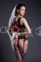 Graceful sexual bride posing in black lingerie