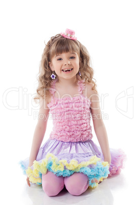 Smiling curly girl posing in candy costume