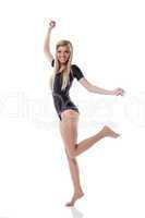 Young beautiful blonde posing jumping in studio