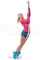 Cheerful sporty woman posing with rope in studio