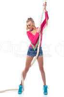 Young athletic girl posing with rope