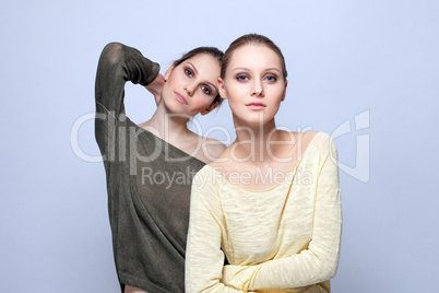 Image of young fashionable models posing in studio