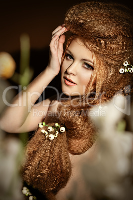 Portrait of young woman with curly golden hair