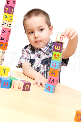 child building a tower