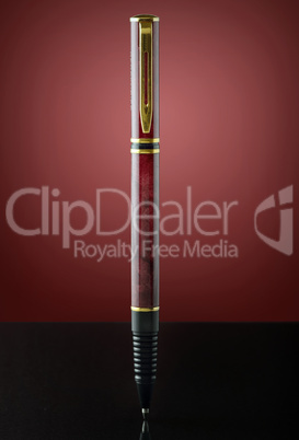 isolated red and golden pen