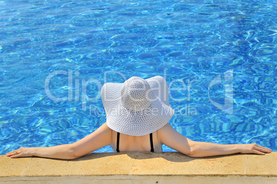 woman with white hat relaxing