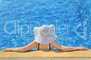 woman with white hat relaxing