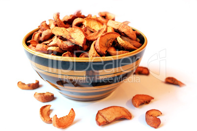 dried apples in the plate on the white background