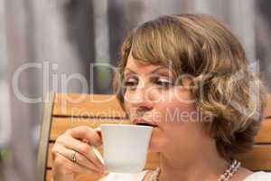 Attractive woman drinking coffee