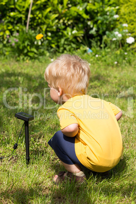 Kid interested by solar battery