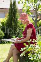 Aged woman reading book