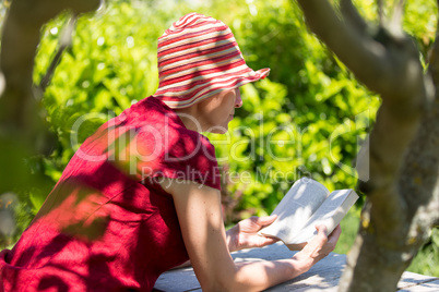 Mature woman reading book