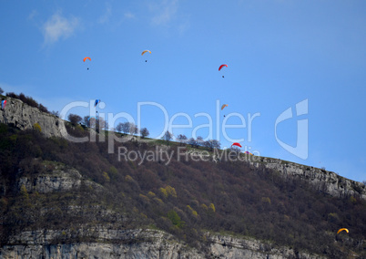 People doing paragliding in the mountains