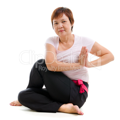 Asian senior woman practicing yoga