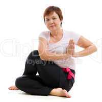 Asian senior woman practicing yoga