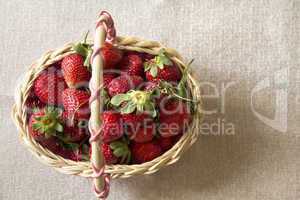 Fresh strawberries in a small basket