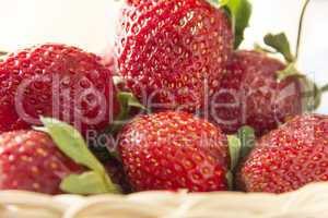 Clouse-up of fresh strawberries in a small basket