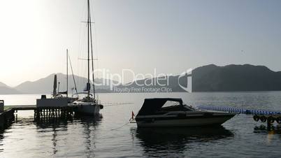 Yacht at the pier and motor boat on Mediterranean turkish resort, Marmaris, Turkey