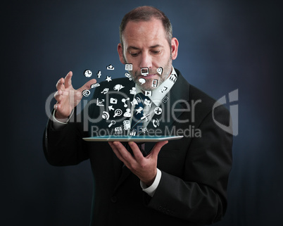 tablet pc with cloud of application icons