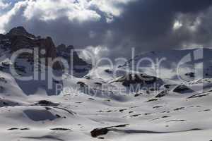 snowy mountains in storm clouds
