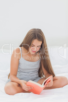 Cute girl reading a book