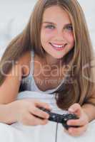 Portrait of a young girl playing video games