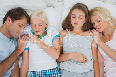 Cute family sleeping together