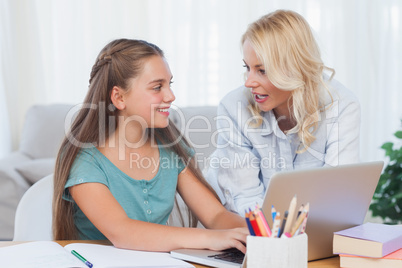 Mother and daughter using a computer