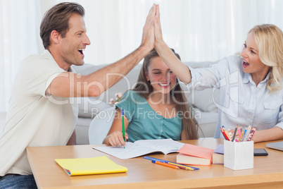 Happy parents high fiving
