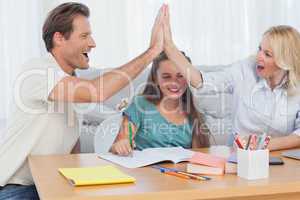 Happy parents high fiving