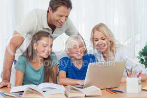 Parents and children using a computer