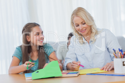 Mother doing arts and crafts with her daughter