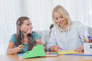 Mother doing arts and crafts with her daughter