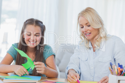 Mother and daughter doing arts and crafts together