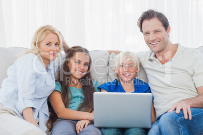 Family using a laptop together