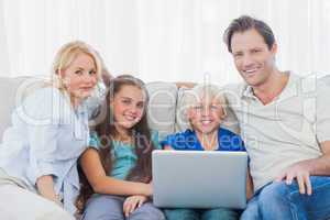 Family using a laptop together