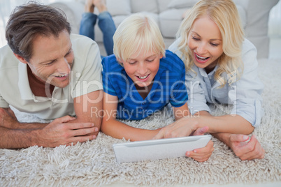 Son and parents using a tablet