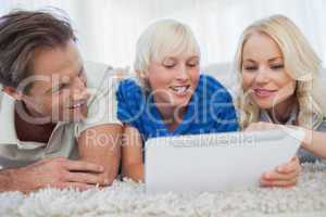 Son and his parents using a tablet
